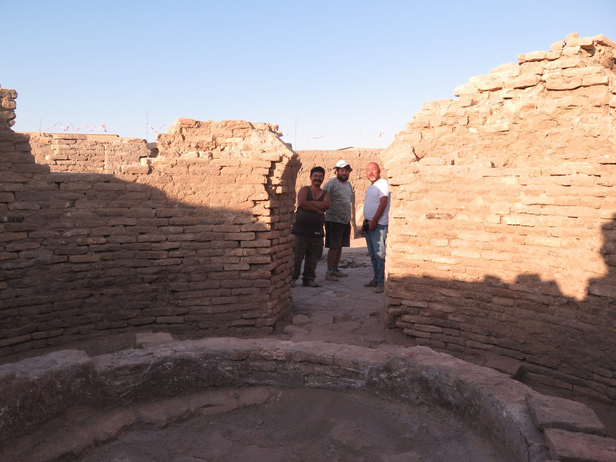 Team members at a bathhouse excavated by Serik Akylbek at Otrar